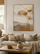 Gold textured floral wall art displayed in a modern neutral living room