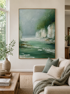 Green landscape wall art displayed in a modern neutral living room