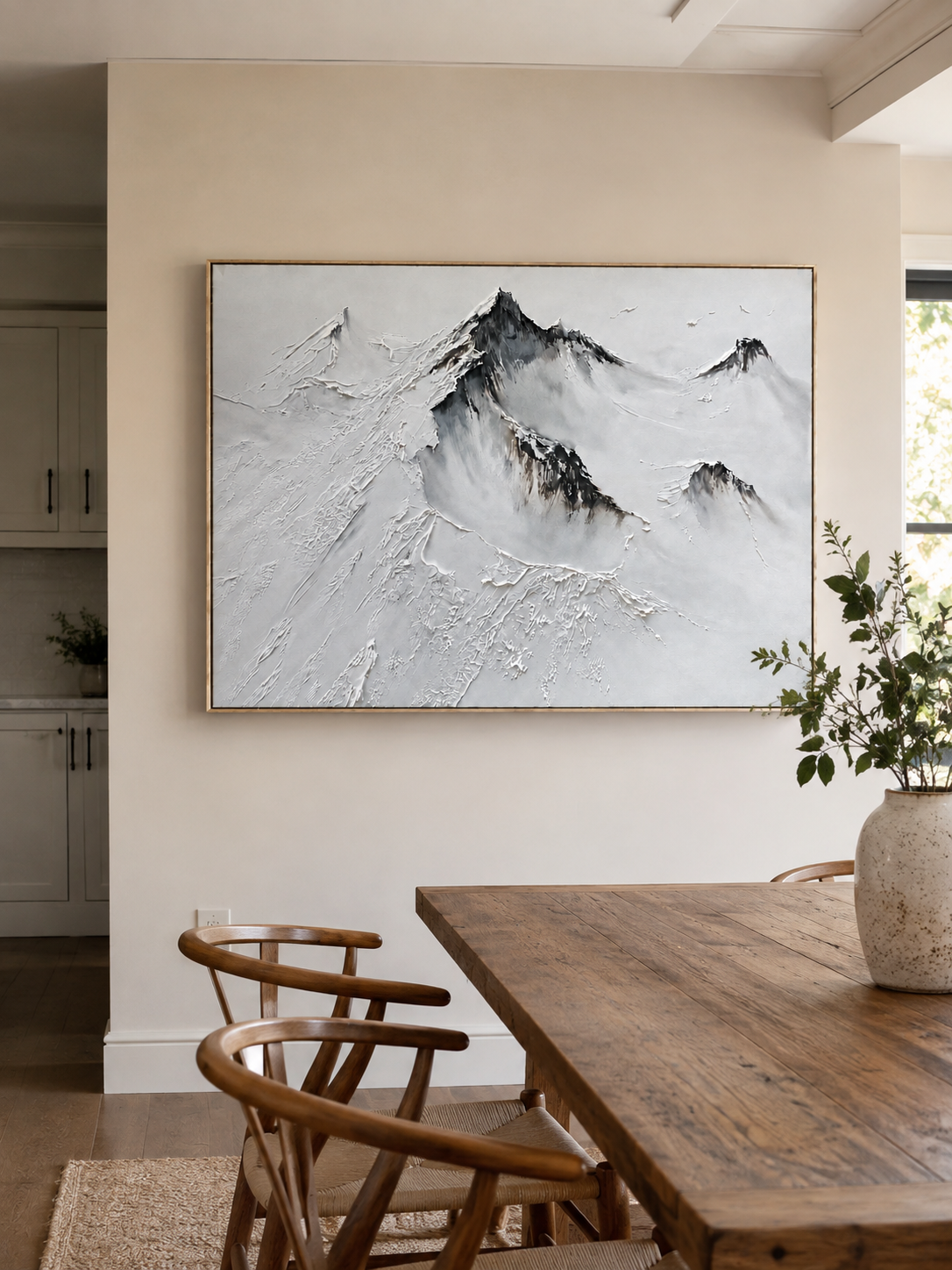 Horizontal textured mountain landscape displayed in a warm open-plan dining room