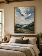 Textured coastal valley wall art displayed above a bed in a calm modern bedroom