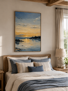 Blue and gold seascape wall art displayed above the bed in a calm neutral modern bedroom