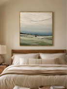 Minimalist neutral countryside wall art displayed above the bed in a calm modern bedroom with natural decor