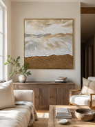 Neutral textured ocean wave painting by Leo Liang displayed above a beige sofa in an organic modern living room