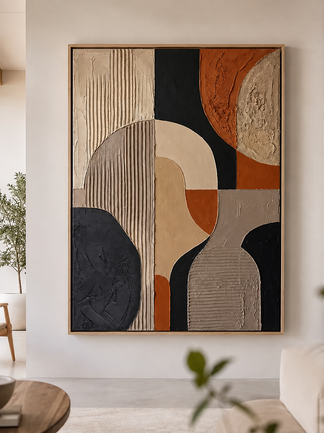 Modern abstract relief painting with geometric shapes and multiple textures in beige, black, terracotta, and grey colors.