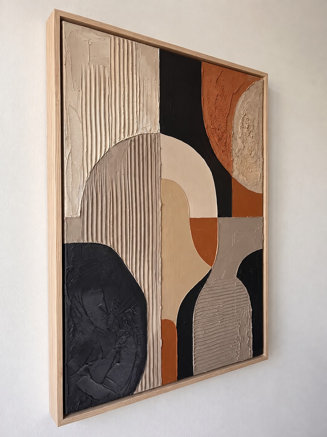 Side angle view of geometric abstract textured art, showing the 3D relief and natural wood frame thickness.