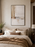 Ivory and beige textured wall art displayed above the bed in a calm minimalist bedroom