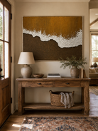 Wabi-Sabi brown coastal painting displayed above a wood console in an organic modern entryway