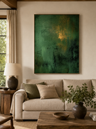 Emerald green abstract painting displayed above neutral furniture in an organic modern living room