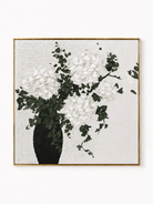 Hand-painted white hydrangea wall art with textured blooms, dark green leaves and black vase by Maya Lin
