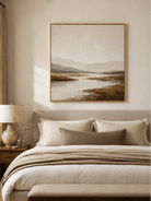 Warm neutral mountain landscape painting displayed above the bed in an organic modern bedroom