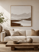 Large wabi-sabi mountain landscape wall art displayed above a beige sofa in a neutral modern living room