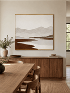 Earth tone mountain landscape wall art displayed in an organic modern open dining room
