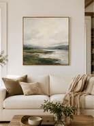 Large green textured landscape wall art displayed above a beige sofa in an organic modern living room