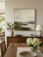 Large green and beige landscape wall art displayed in an organic modern open dining room