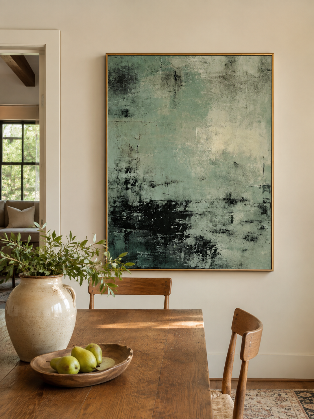 Textured sage green abstract wall art displayed in an open-plan dining room