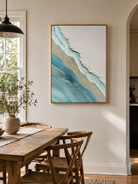 Textured ocean shoreline canvas styled in a bright open-plan dining room with neutral décor