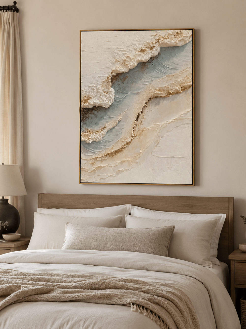 Neutral blue and ivory coastal wall art displayed above a bed in a calm modern bedroom