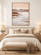 Textured blush beige and taupe mountain landscape painting displayed above a dresser in a neutral bedroom