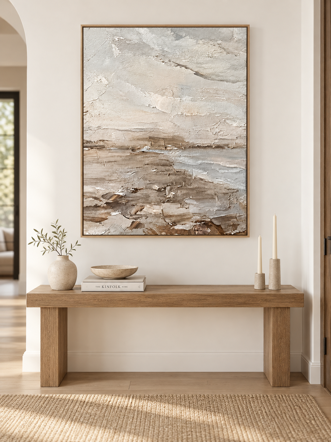 Large vertical wabi-sabi textured wall art displayed above an entryway console in a neutral interior