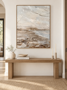 Large vertical wabi-sabi textured wall art displayed above an entryway console in a neutral interior