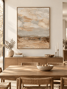 Vertical neutral textured wall art displayed in an open dining room with natural wood and stone furniture