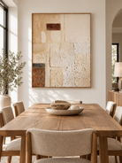 Hand-painted geometric textured wall art displayed in a modern organic open-plan dining room