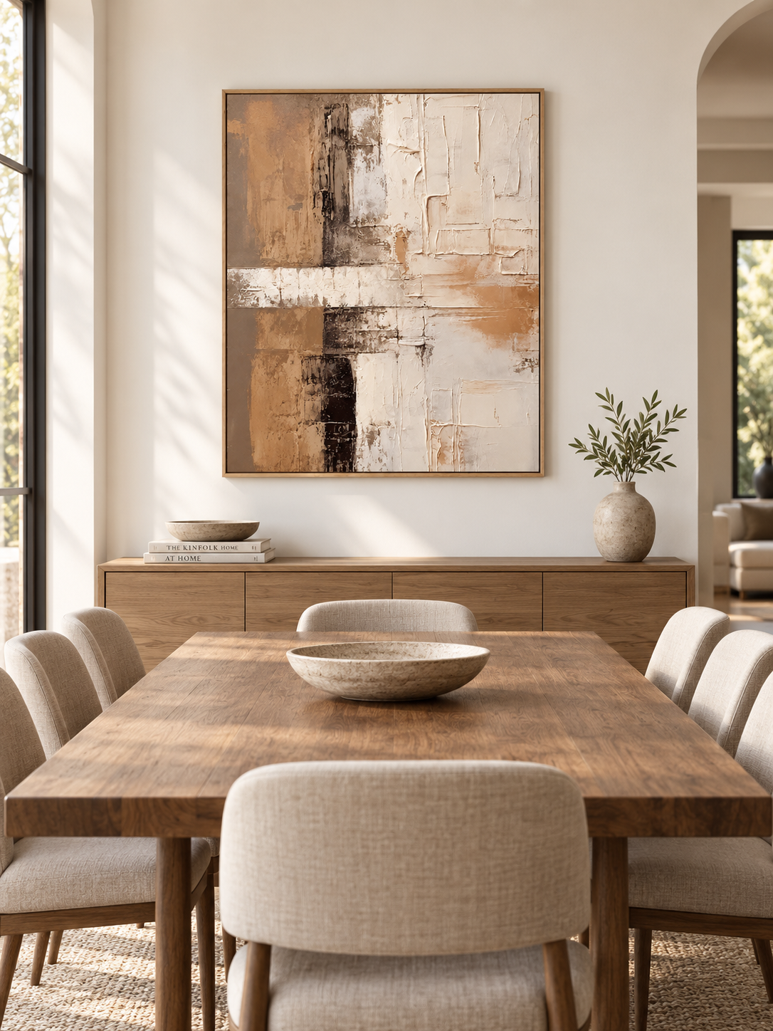 Hand-painted neutral abstract wall art displayed in a modern organic open-plan dining room