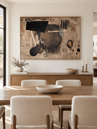 Hand-painted earth tone abstract wall art displayed in a contemporary open-plan dining room