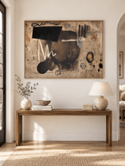 Large horizontal contemporary abstract painting displayed above a console in a modern entryway