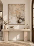 Vertical Wabi Sabi floral vase wall art displayed above a console in a neutral entryway