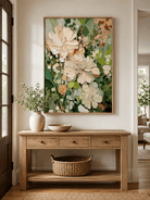 Vertical textured floral wall art displayed above an entryway console in an organic modern interior