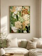 Large sage green botanical wall art displayed in a modern living room with beige and cream furniture