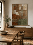 Textured terracotta and olive geometric wall art displayed in an organic modern open dining room
