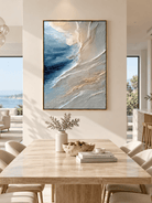 Hand-painted textured ocean wave wall art displayed in a modern organic open-plan dining room