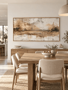 Hand-painted panoramic landscape painting with warm golden reflections displayed in an open-plan dining room