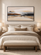 Warm neutral panoramic abstract painting with rust accents displayed above a bed in a modern bedroom