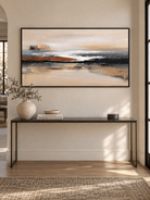 Large horizontal earth-tone abstract painting displayed above a long console in a contemporary entryway