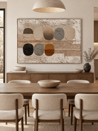 Hand-painted geometric wall art with organic oval shapes displayed in a modern open-plan dining room
