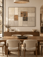 Hand-painted geometric block painting displayed above a sideboard in a contemporary open-plan dining room