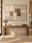 Horizontal neutral textured abstract painting displayed above a console in a modern minimalist entryway