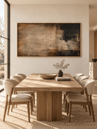 Hand-painted dark brown abstract wall art with distressed texture displayed in a modern open-plan dining room