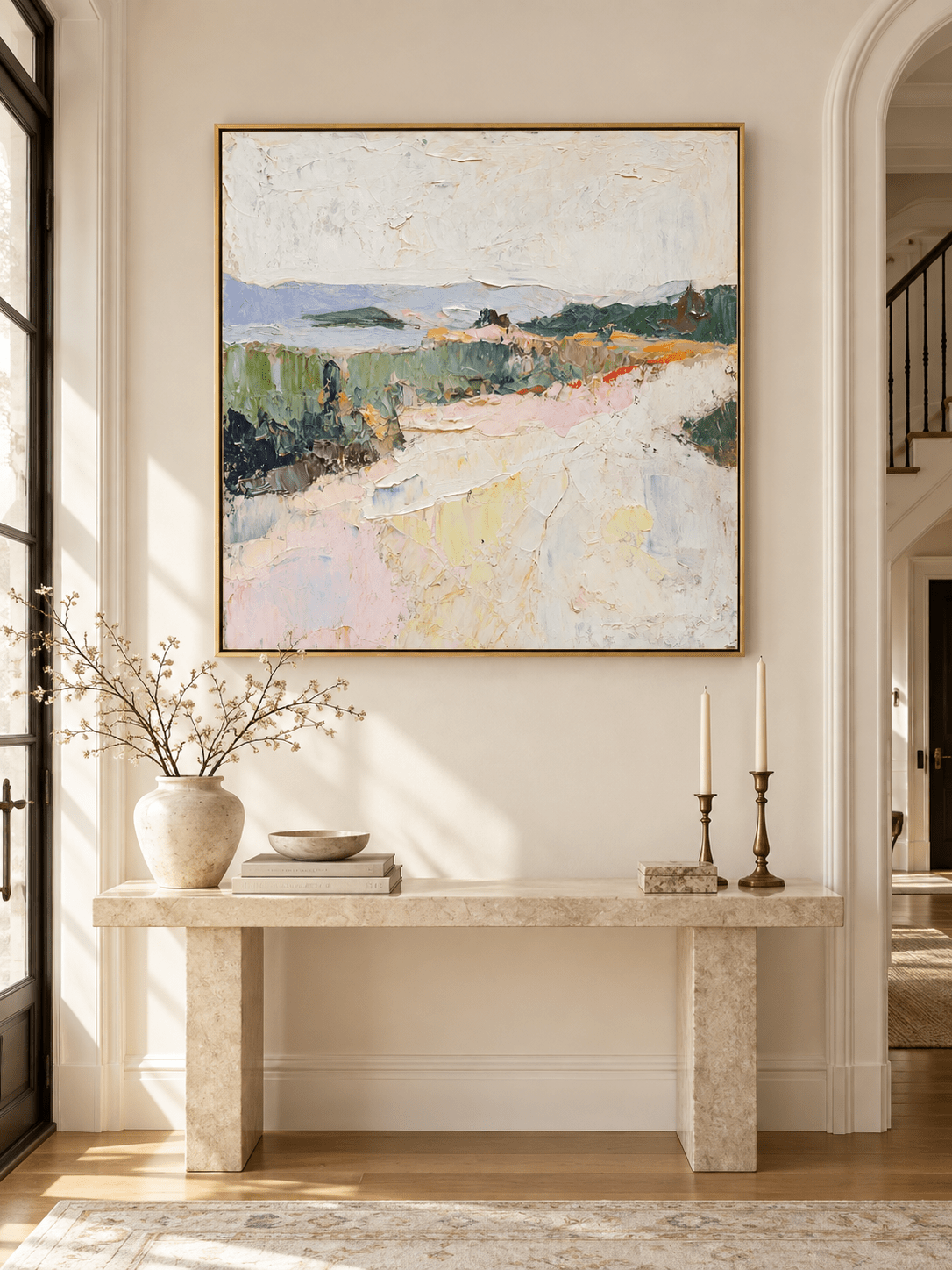 Square pastel landscape wall art with lavender blue hills and green fields displayed above an entryway console