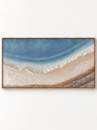 Hand-painted blue ocean shoreline painting with textured white seafoam, warm beige sand and an aerial coastal view by Leo Liang