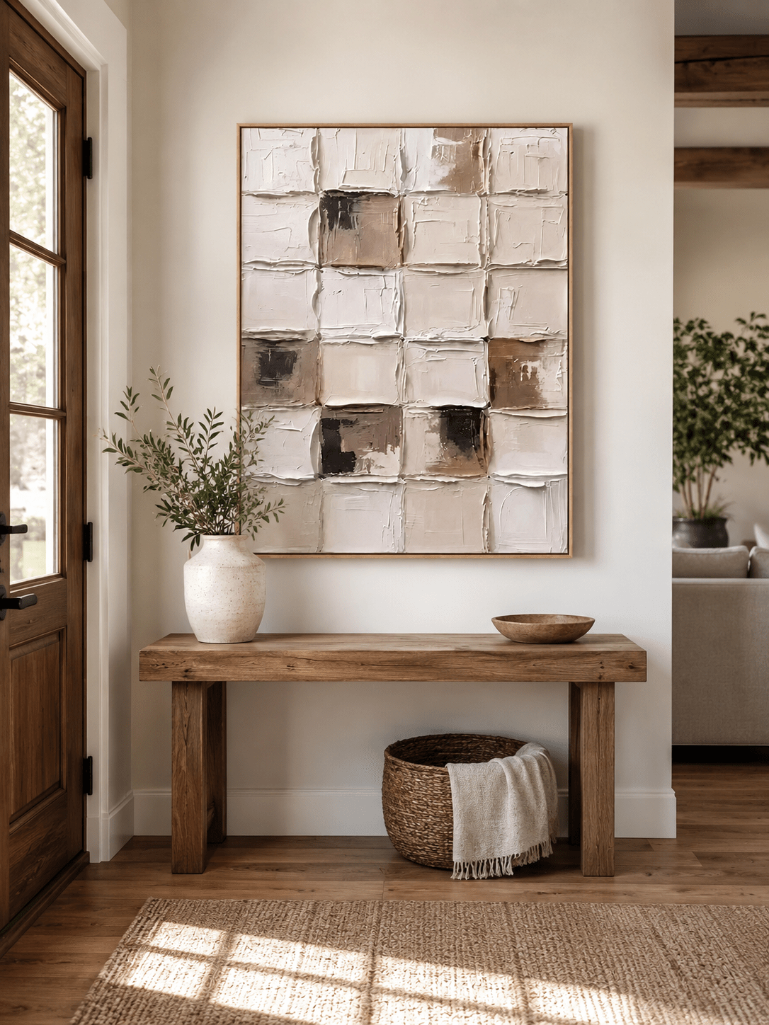 Vertical neutral textured geometric wall art displayed above an entryway console in a Japandi-inspired interior