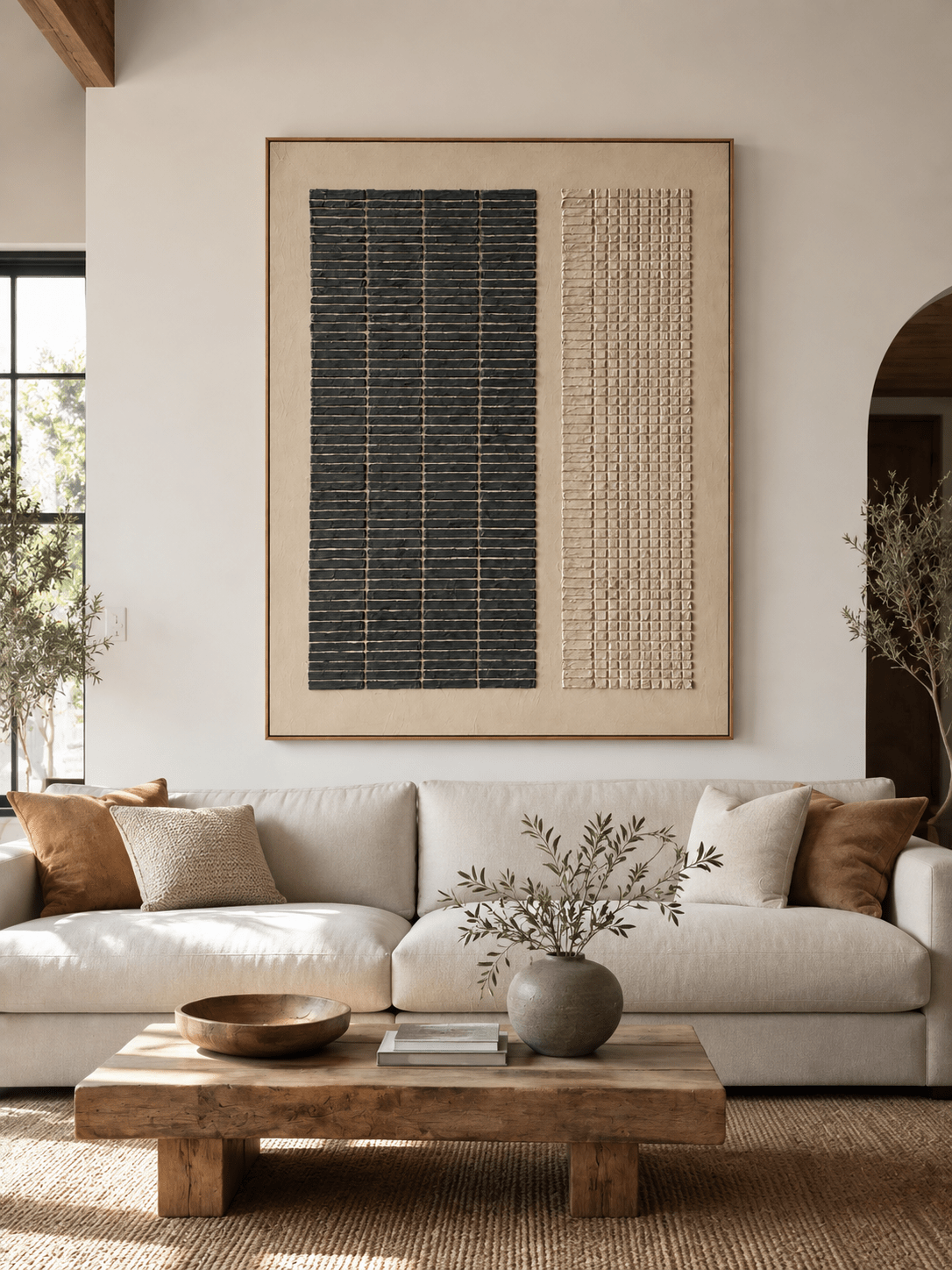 Large black and beige textured geometric wall art displayed above a neutral sofa in a Japandi living room