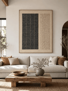 Large black and beige textured geometric wall art displayed above a neutral sofa in a Japandi living room