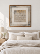Ivory taupe and gray wabi-sabi textured painting displayed above the bed in a warm minimalist bedroom