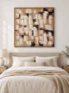Warm beige caramel and black textured abstract painting displayed above the bed in a neutral modern bedroom
