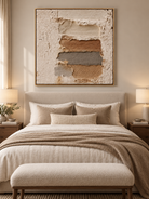 Ivory beige and rust brown wabi-sabi textured painting displayed above the bed in a warm neutral bedroom