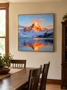Impasto mountain lake reflection painting displayed in a warm open-plan dining room
